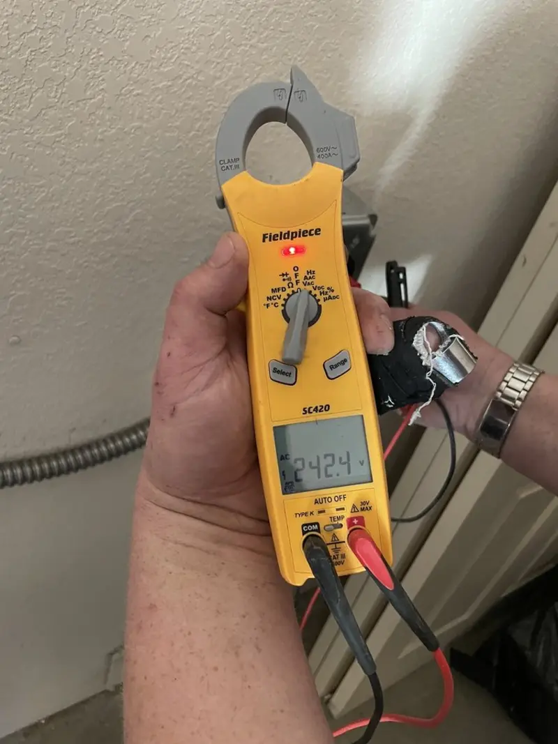 Voltage testing with clamp meter during Recessed Lighting Installation in Lino Lakes